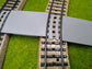 Bahnübergang H0 gebogen für Märklin M-Gleis - 58x40 mm - grau