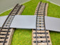 Bahnübergang H0 gebogen für Märklin M-Gleis - 58x40 mm - grau