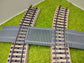 Bahnübergang H0 gebogen für Märklin M-Gleis - 58x40 mm - grau